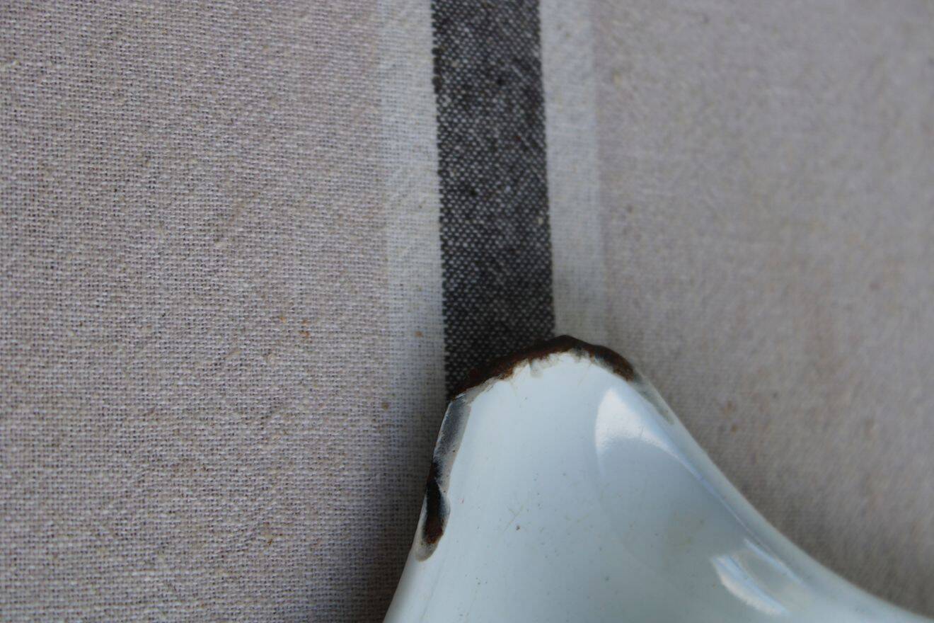 Antique enamel candle holder