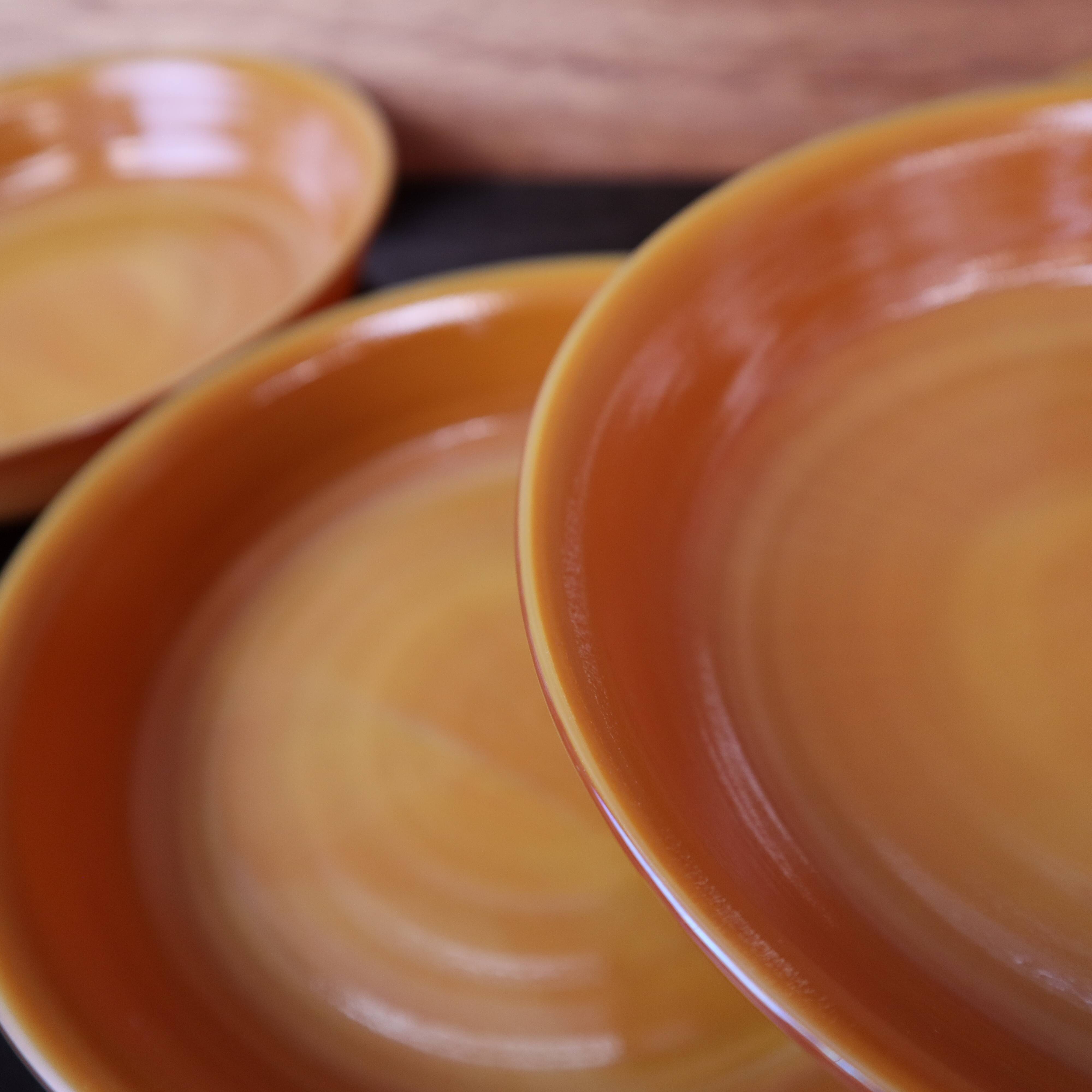 Set of 5 orange deep plates Arcopal France from the 1970s.