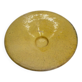Old omelette turner, glazed yellow terracotta, south of France.