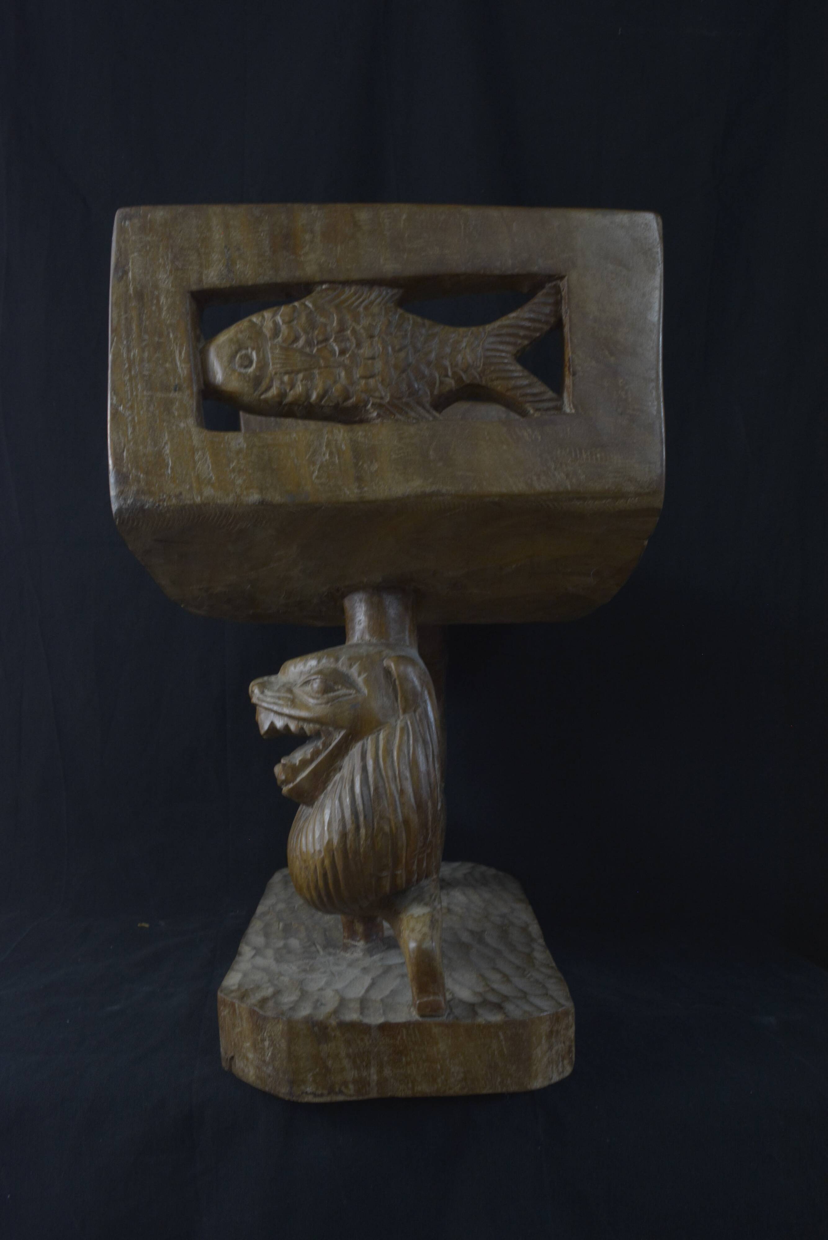 Togolese ethnic stool in carved exotic wood.
