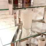 Articulated presentation shelf in chrome and glass. Italy 1970s