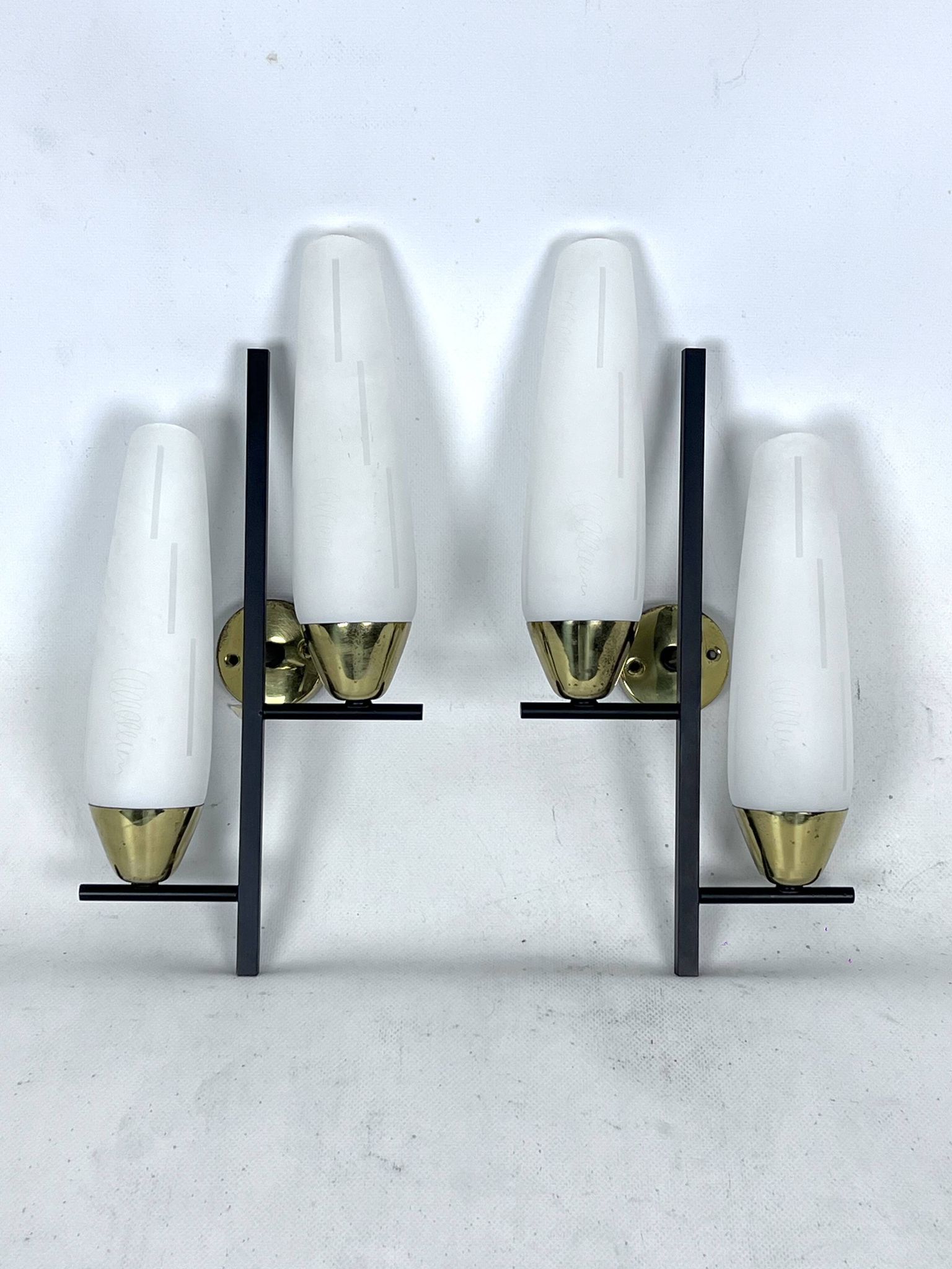 Mid-Century pair of double lights sconces in brass and opaline glass. Italy 1950s