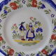Plate of Breton earthenware of regional art KG France Quimper