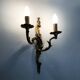 Antique double-light bronze wall light with acanthus leaves. 1950s