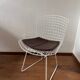 White Wire Chair design by Harry Bertoia with leather cushion.