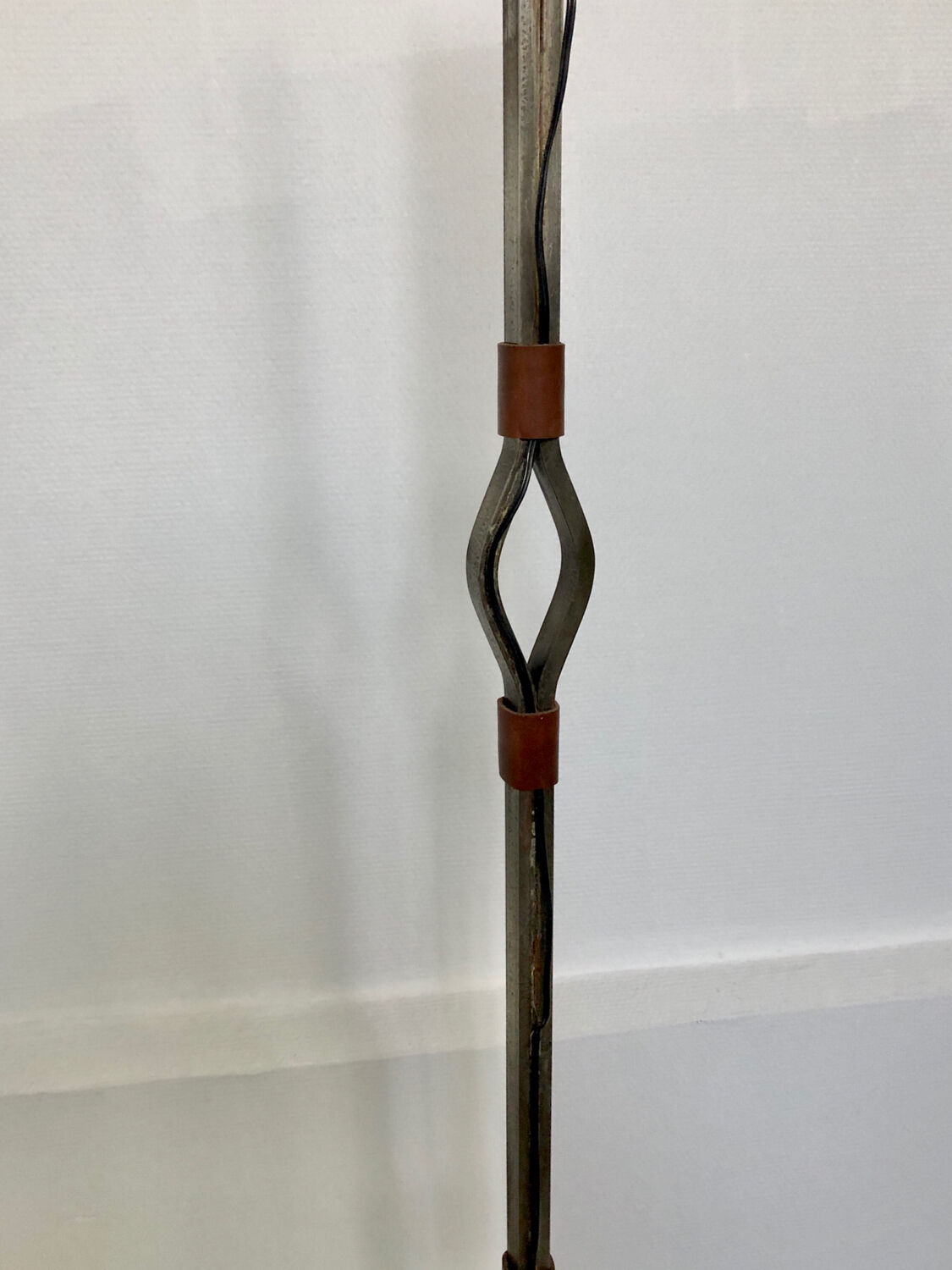 Hammered wrought iron and leather floor lamp by Jean Pierre Rickaert, 1950s