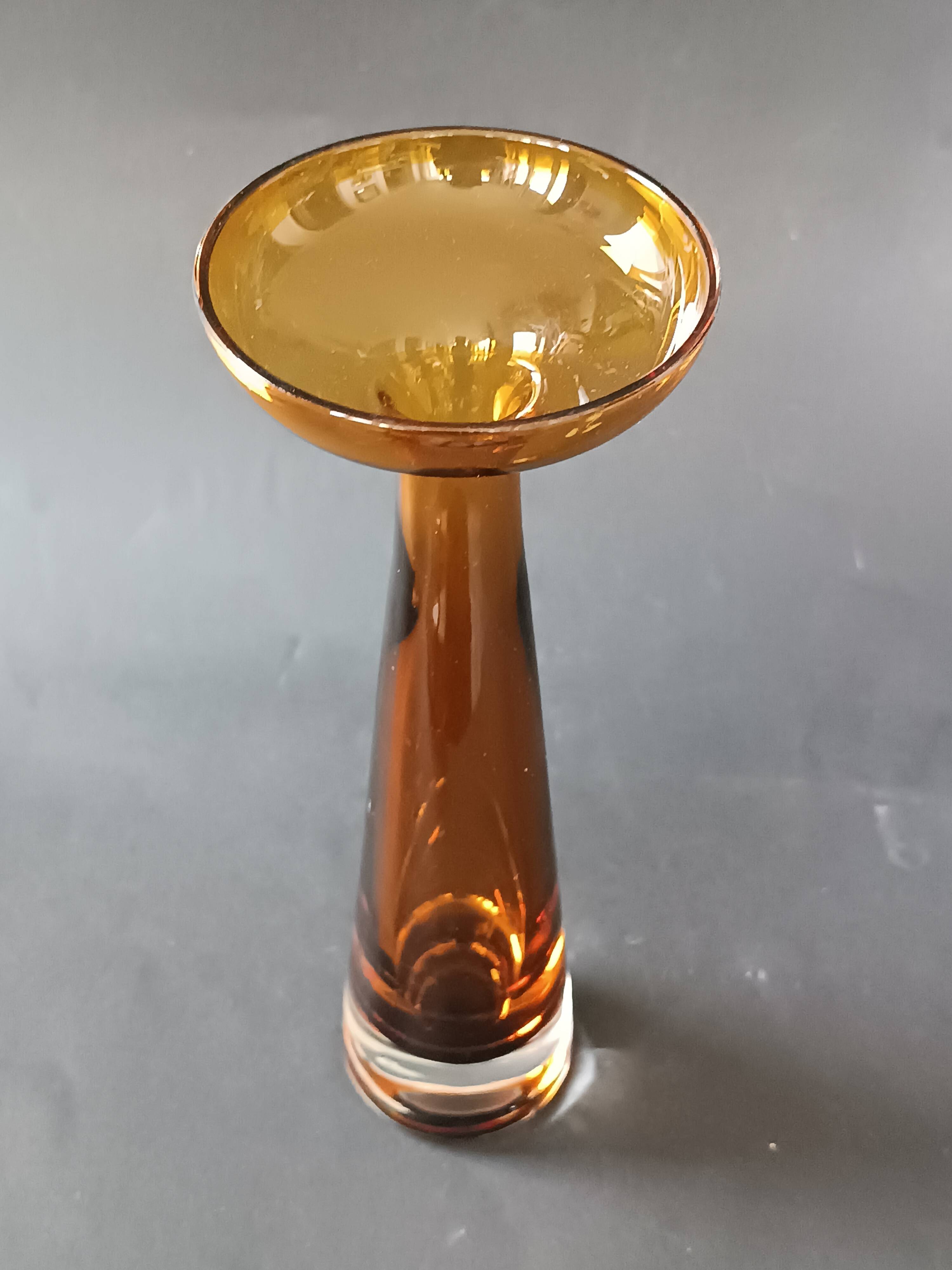 Two vintage Scandinavian double-layered amber blown glass candlesticks
