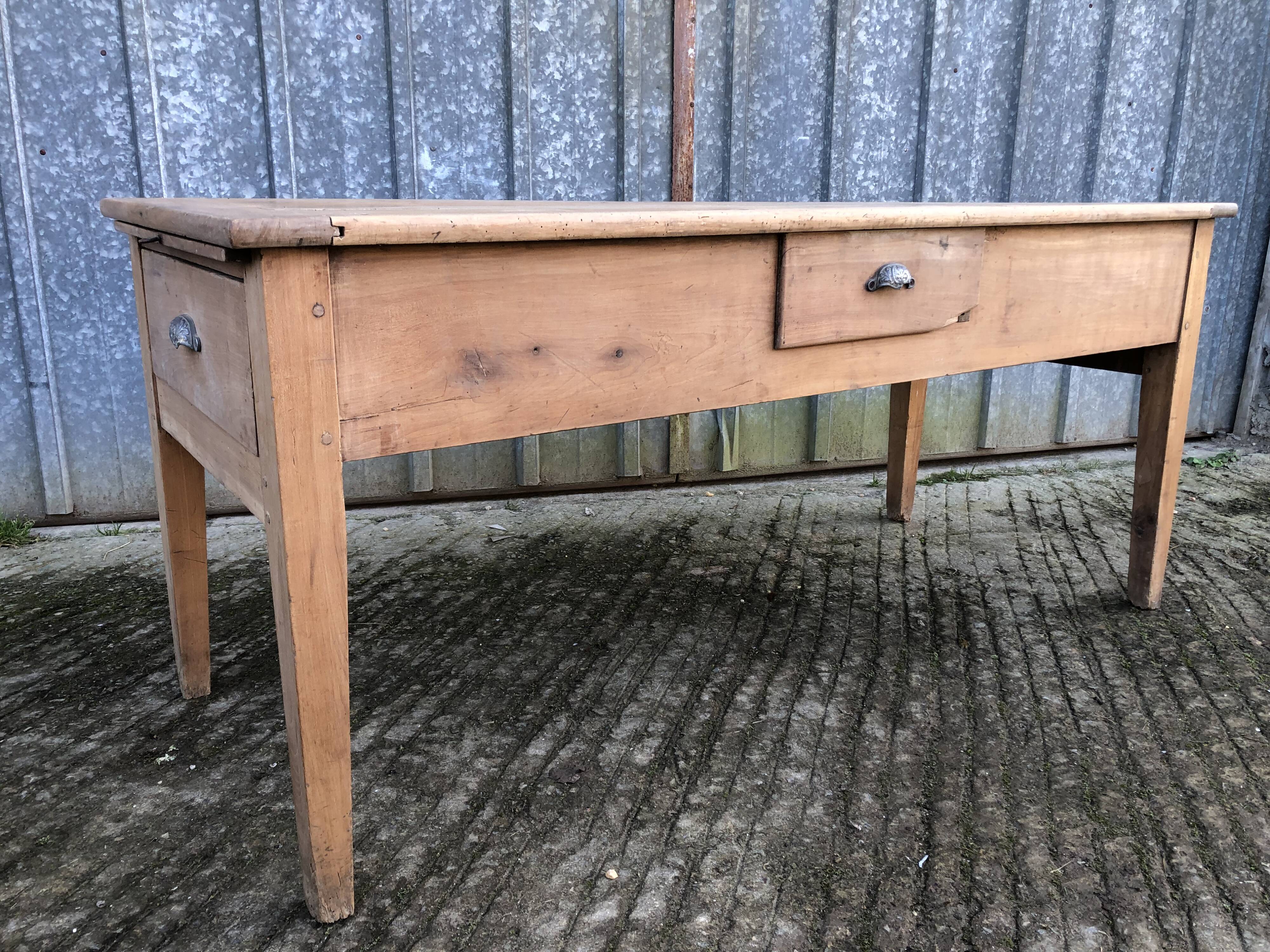 Antique solid cherry farmhouse table with 3 drawers and 1 pull out.