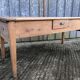 Antique solid cherry farmhouse table with 3 drawers and 1 pull out.