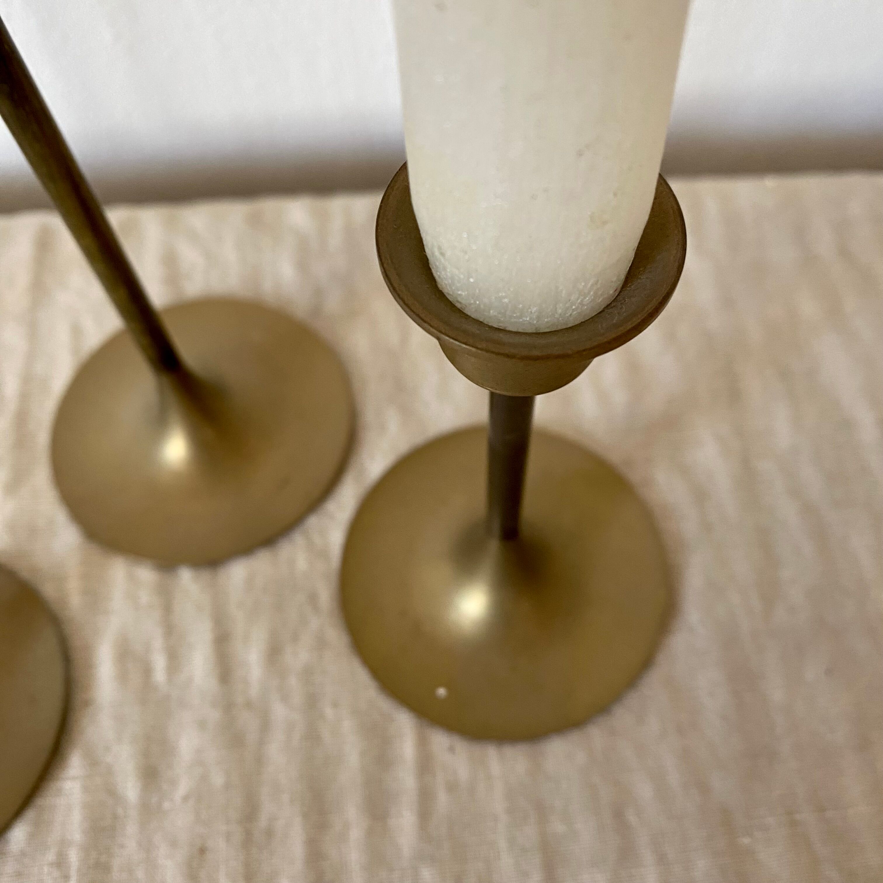 Series of brass candle holders