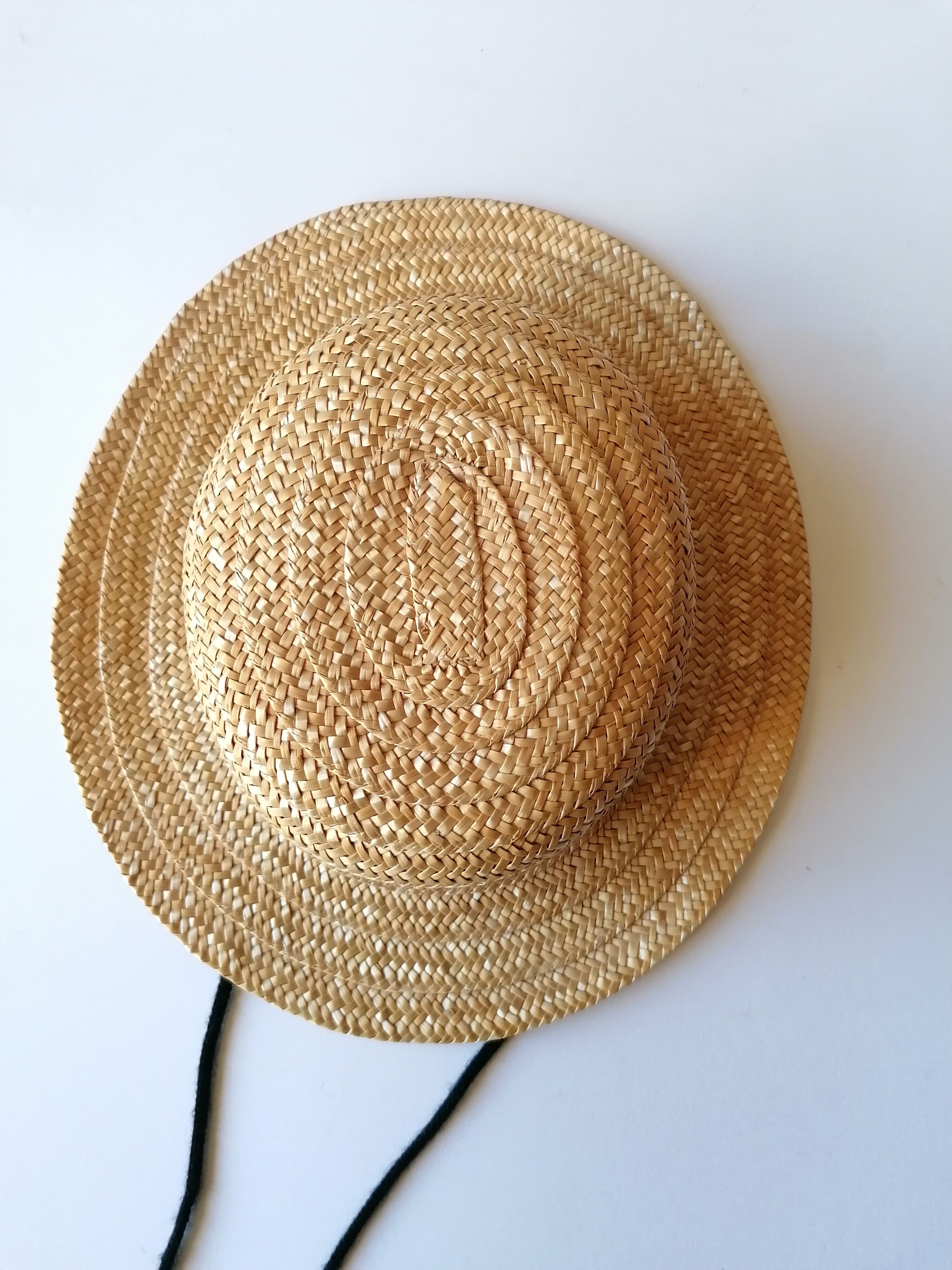 Canoe hat made of woven straw