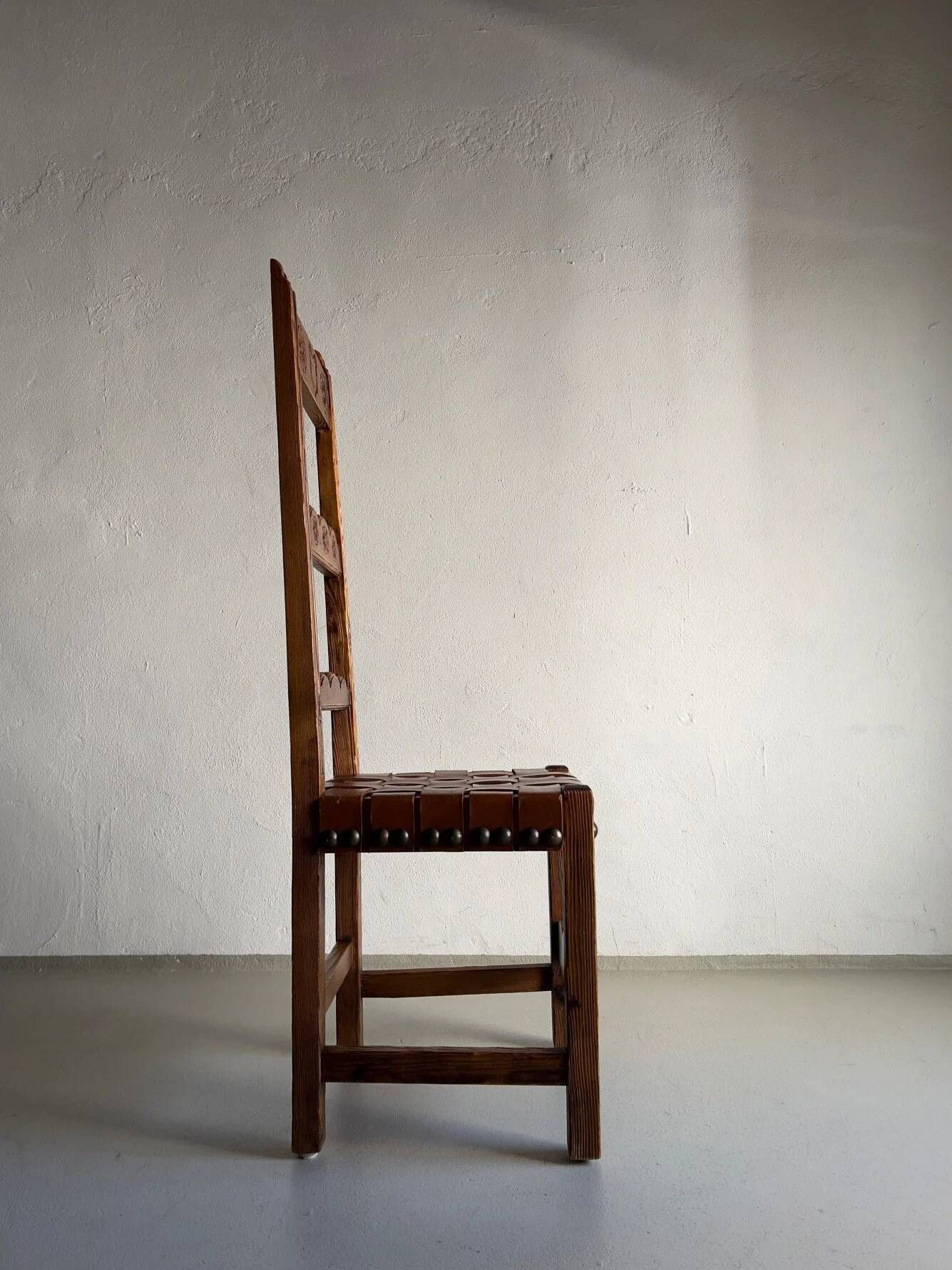 2 brutalist carved wood dining chairs with leather seat | The Netherlands | 1970s