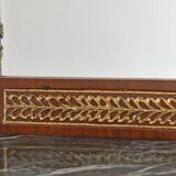 Console topped with an Empire-style mirror.