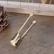 Golden metal sugar tongs