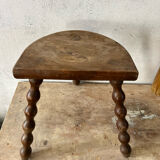 Wooden tripod farm stool