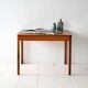 Table basse scandinave vintage en teck avec bord sculpté