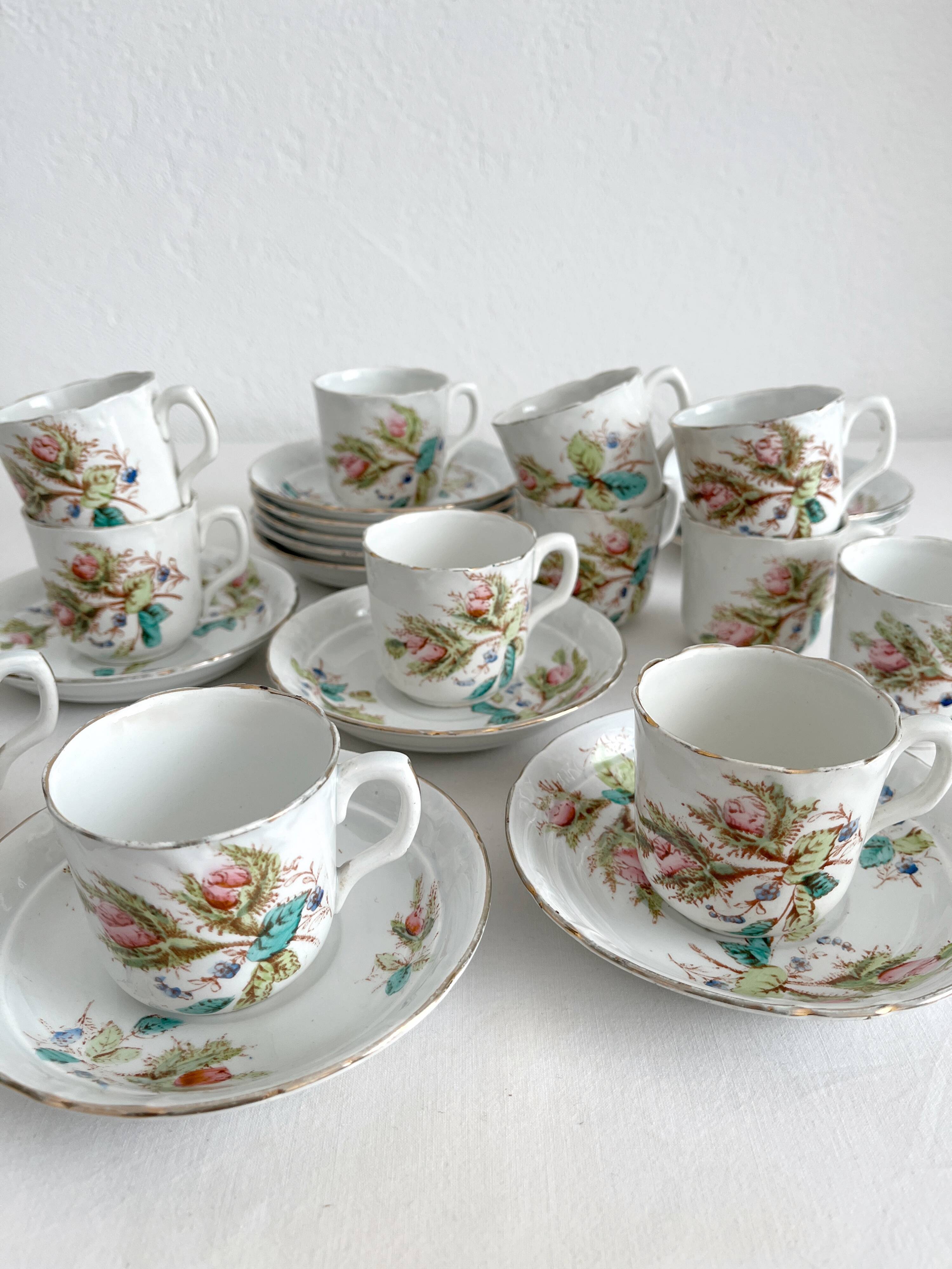 12 ironstone coffee cups with polychrome floral decoration, KG Lunéville