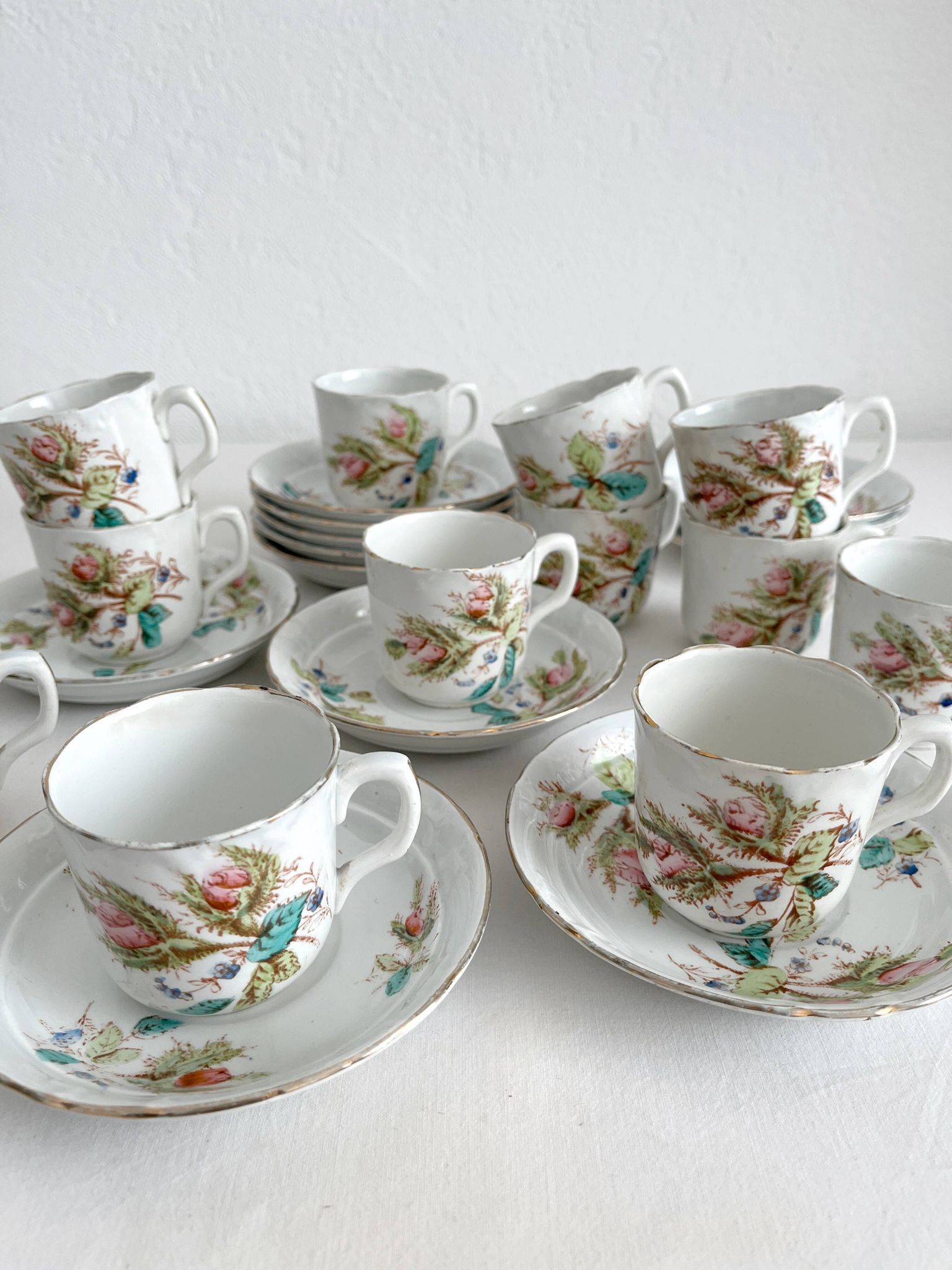 12 ironstone coffee cups with polychrome floral decoration, KG Lunéville