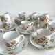 12 ironstone coffee cups with polychrome floral decoration, KG Lunéville