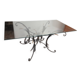Glass top table with iron base in the style of wheat ears. Attributed to Robert Goossens.