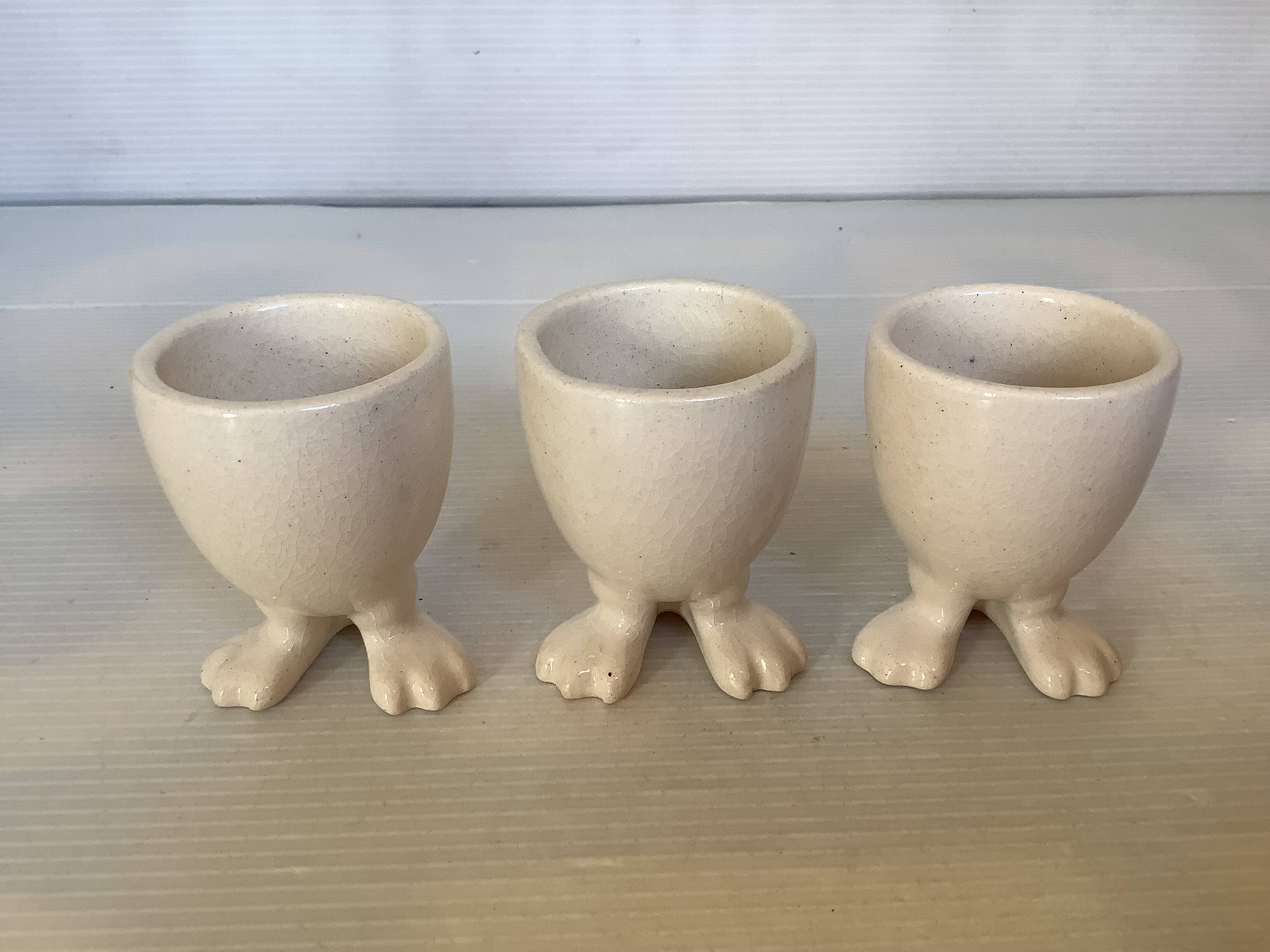 Set of cracked egg cups with feet
