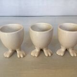 Set of cracked egg cups with feet
