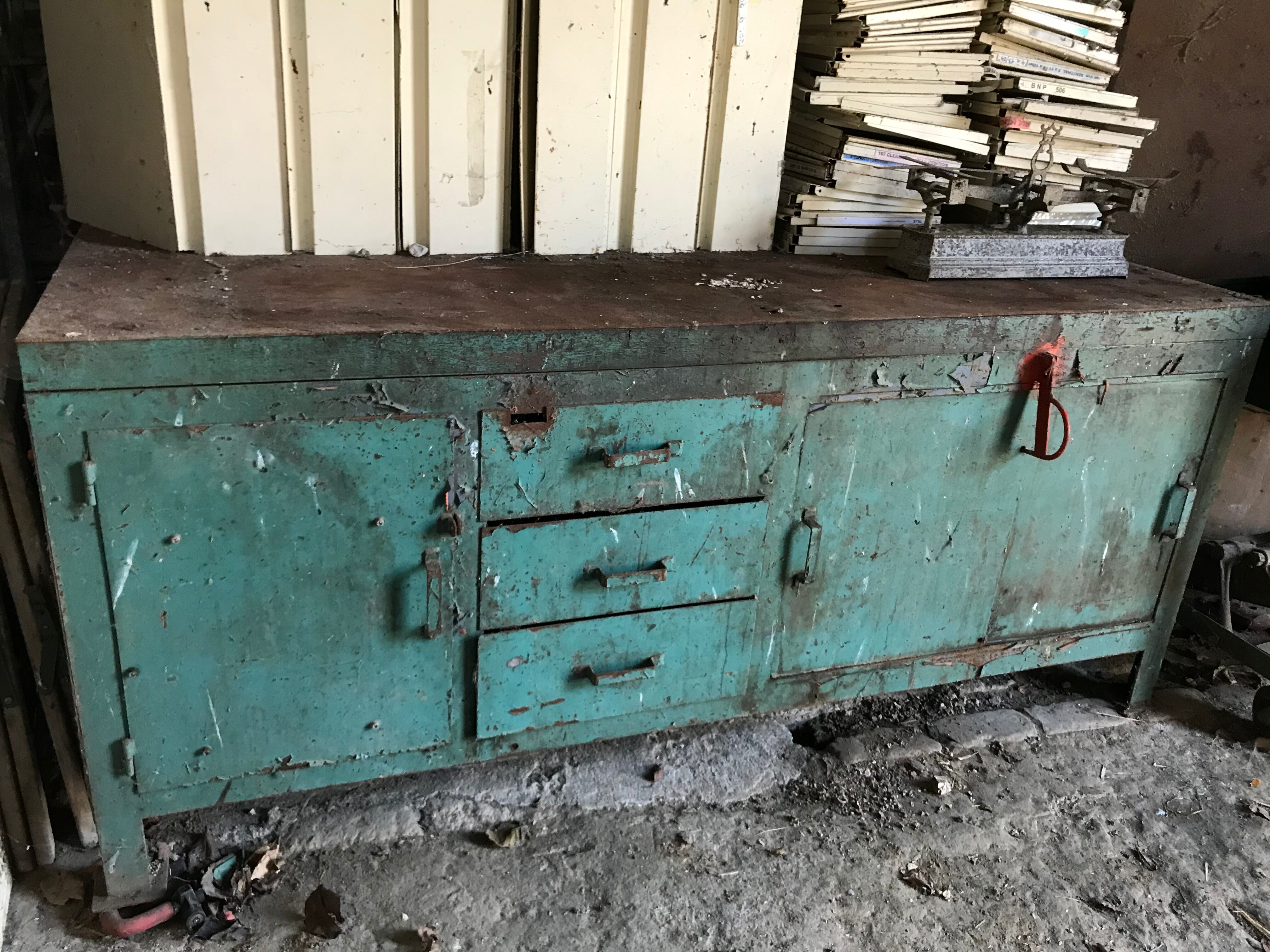 Former industrial workbench in metal