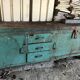 Former industrial workbench in metal