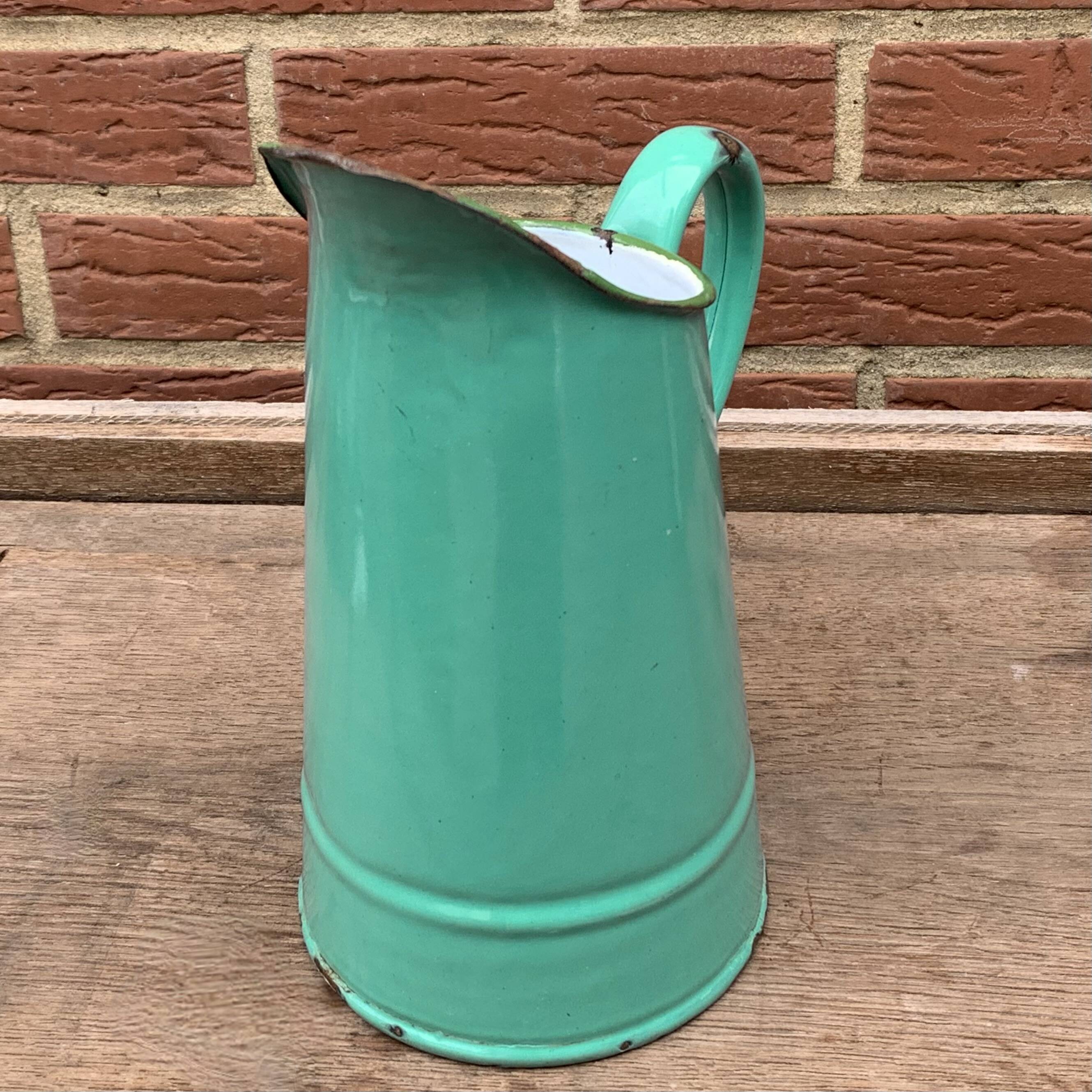 Vintage pitcher in green enameled sheet metal