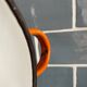Orange enameled sheet egg dish