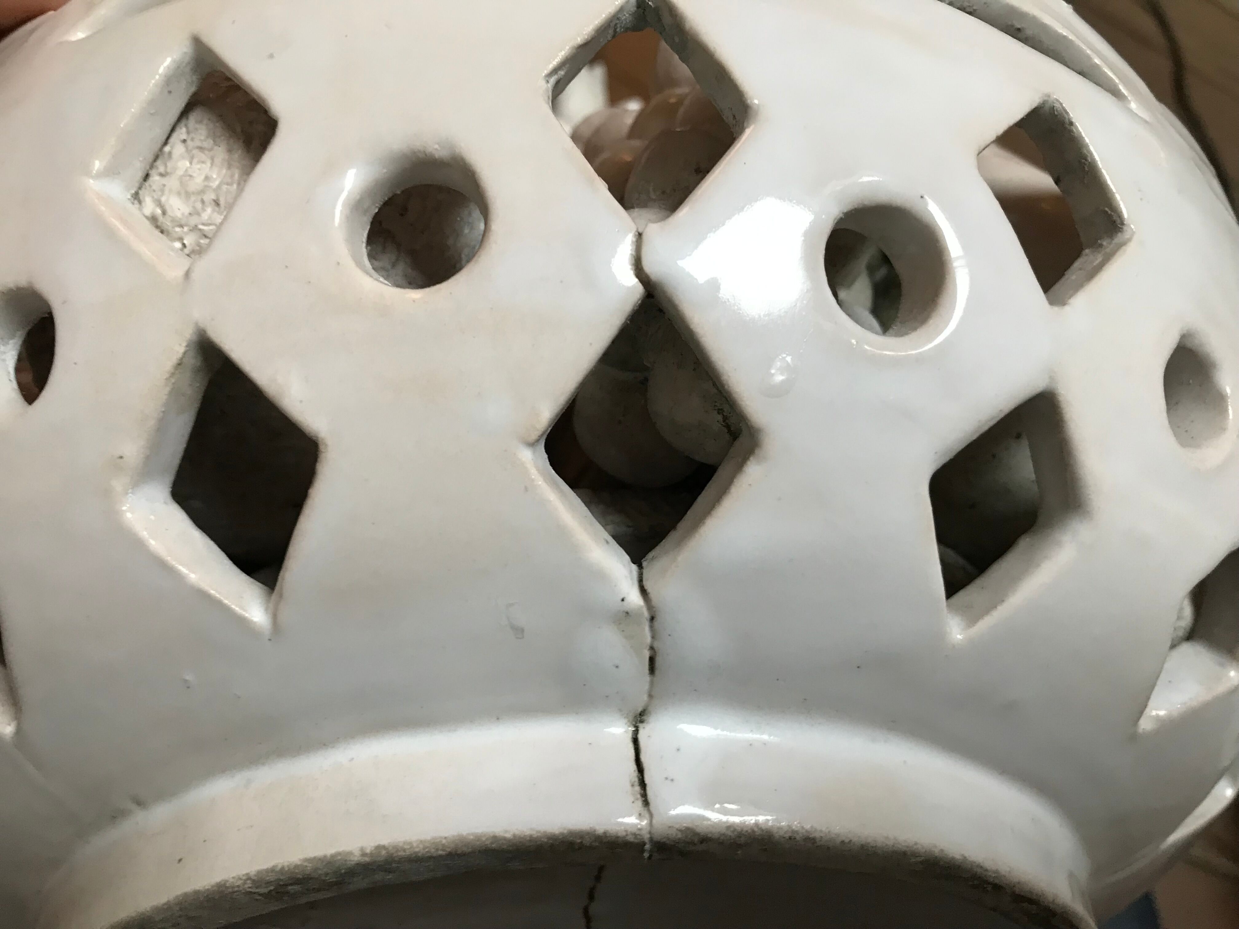 Trompe l'oeil fruit cut in white earthenware by Jean Roger, circa 1960.