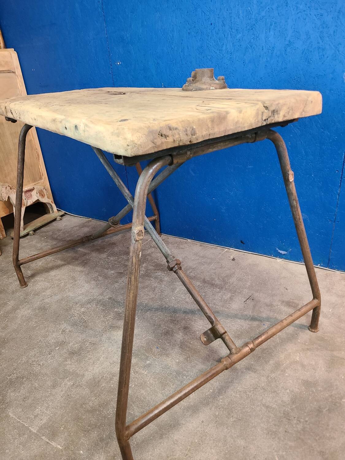Vintage workbench circa 1930, folding metal leg.