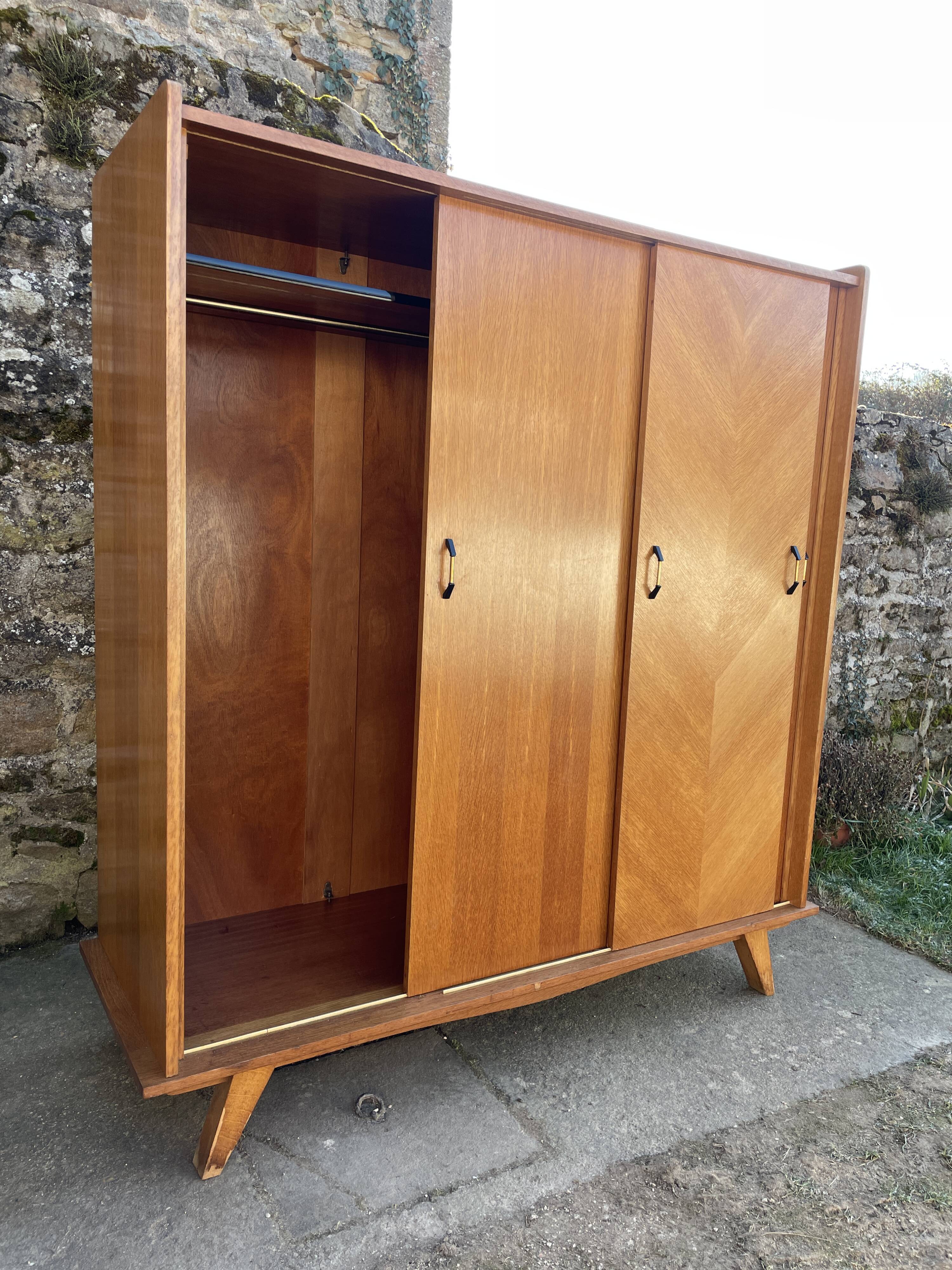 Light oak sliding door wardrobe, 1960