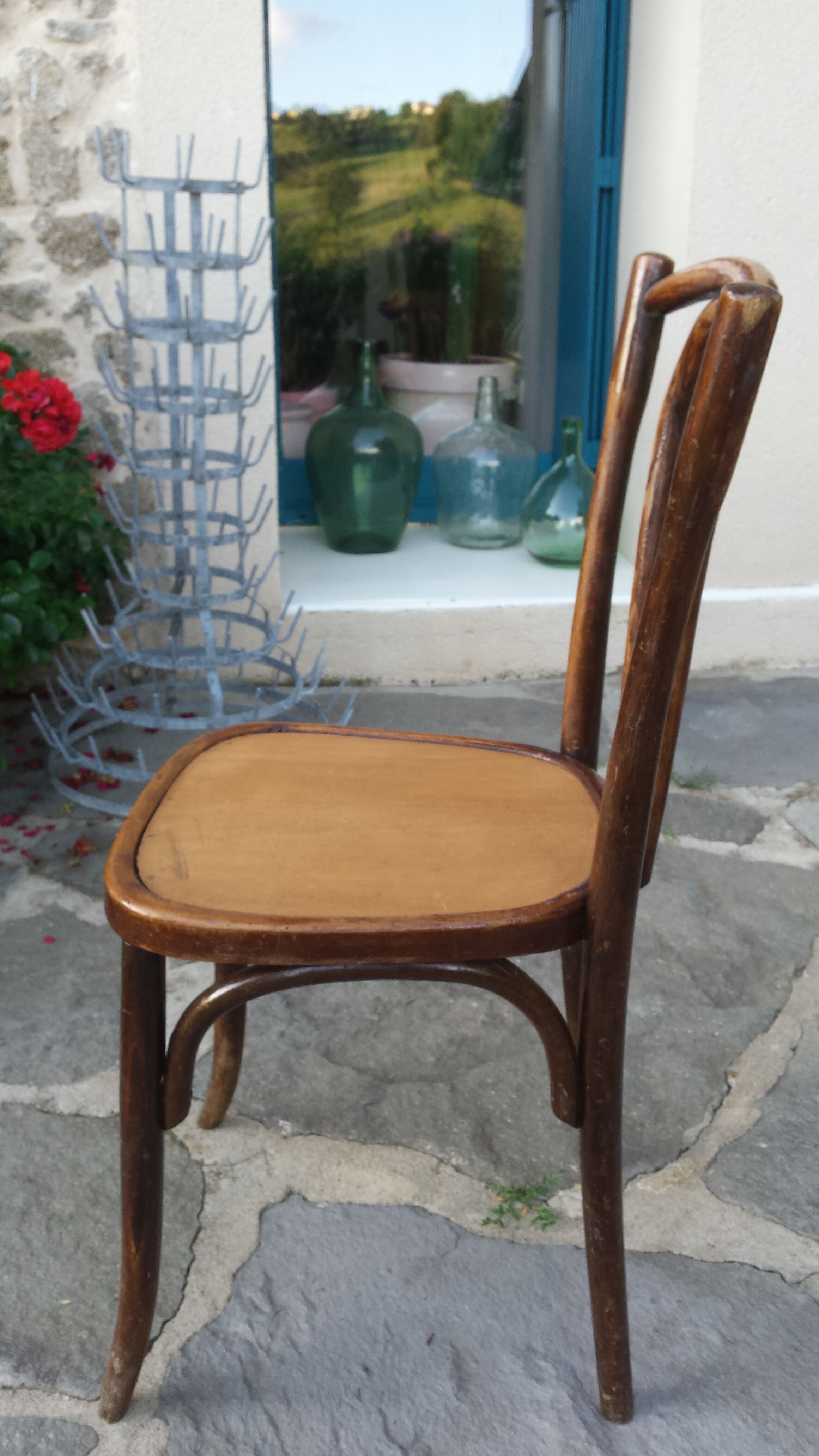 Bistro chair with buchon brand plate