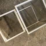 Set of coffee tables, pedestal tables and nesting tables in smoked glass and metal