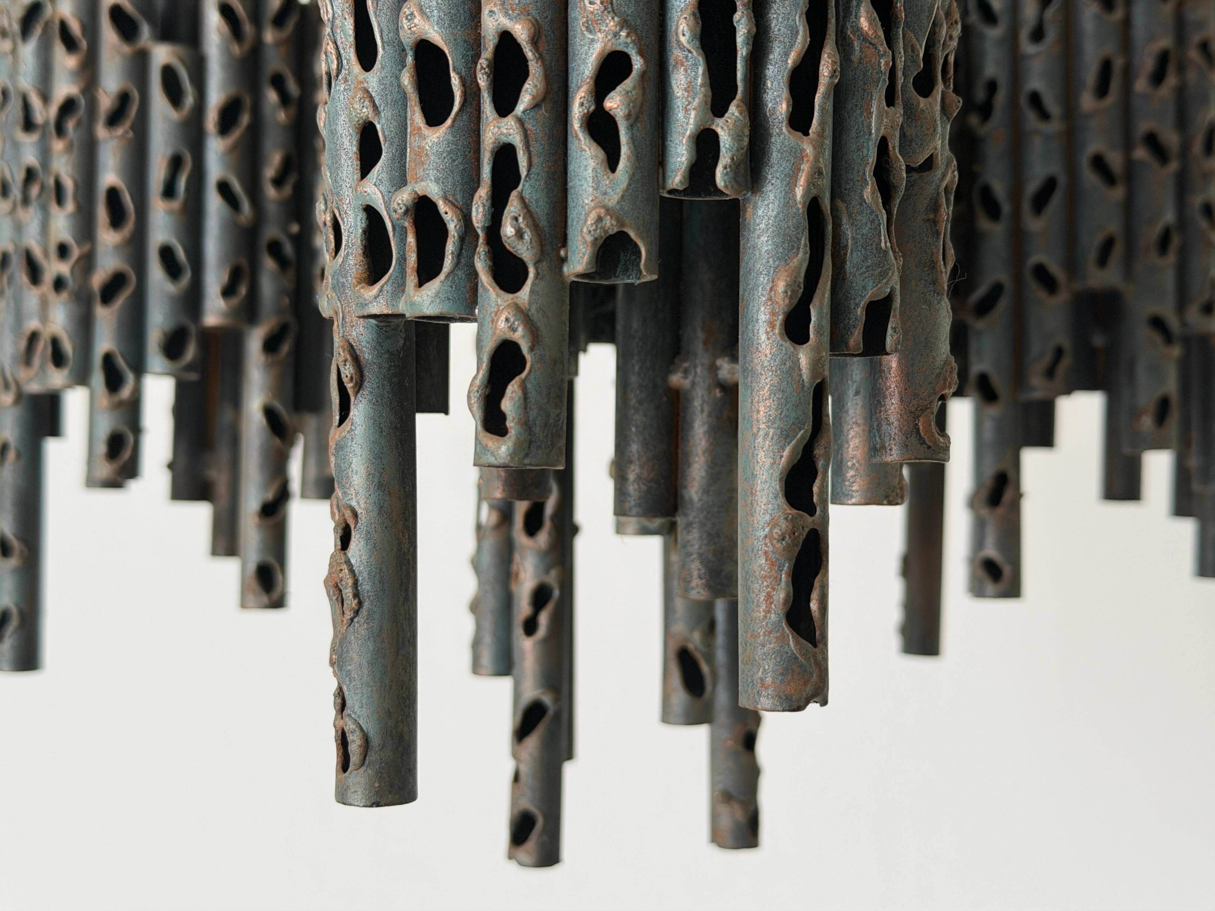 Three-armed suspended lamp in wrought iron, brutalist design, 1960s, Italy.