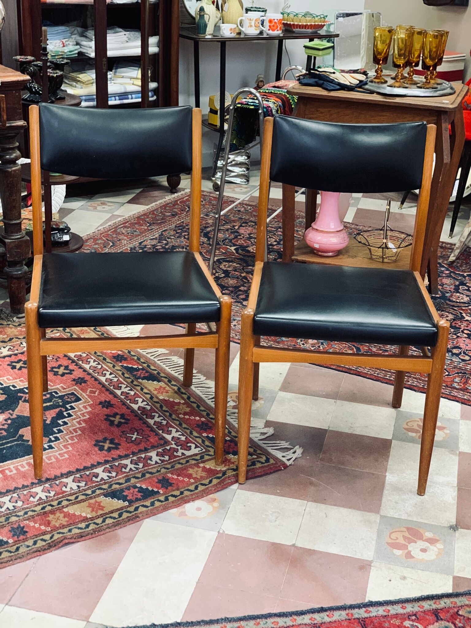 2 Scandinavian-style natural wood chairs, black trim