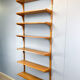 Danish wall shelf by Hansen and Guldborg, teak, aluminum rails, 1960s.