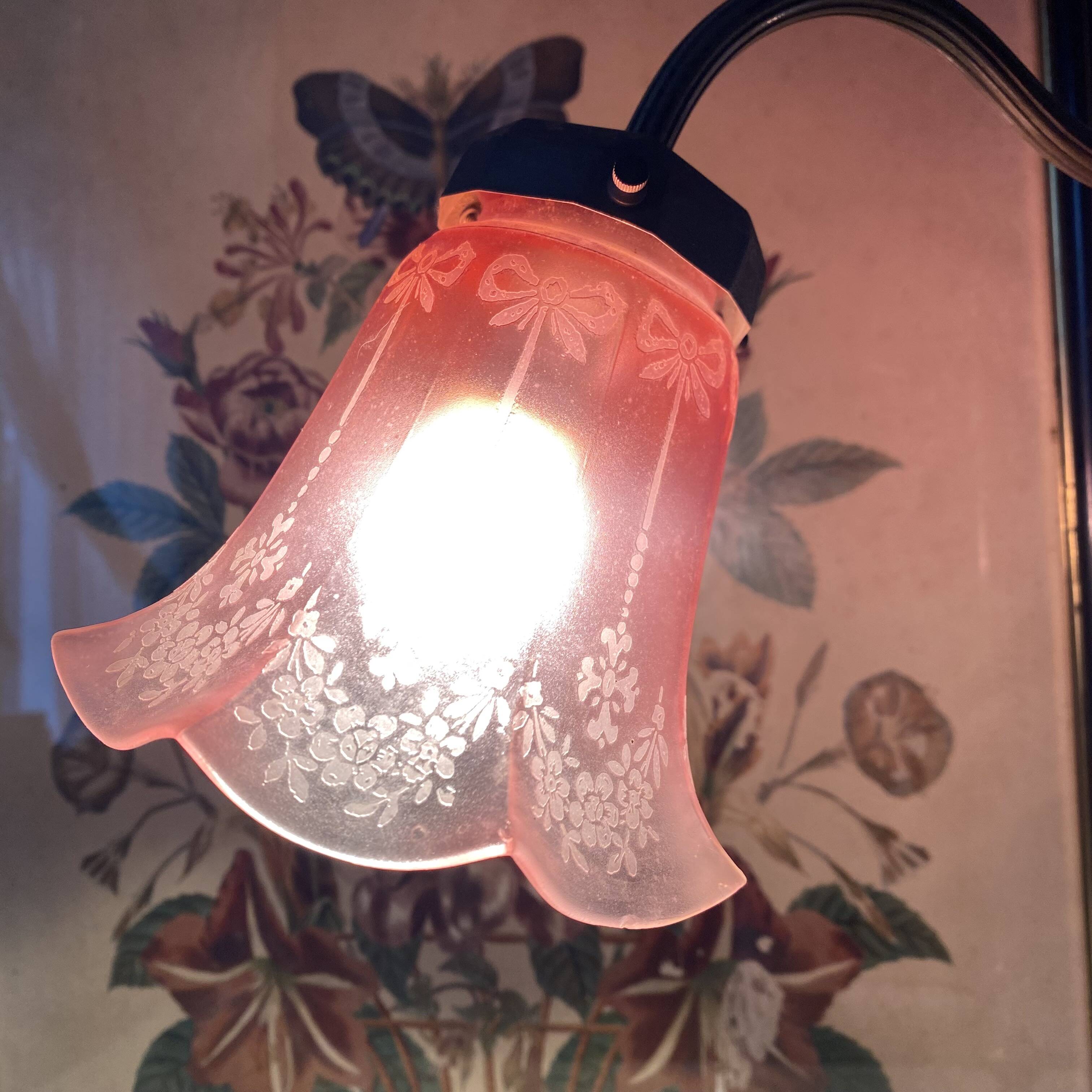 Antique jeweller's lamp, silver-plated base, frosted pink glass shade.