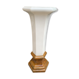 Column wears vintage plant