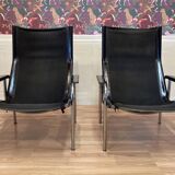 Pair of black leather reclining relaxation armchairs, "Hans Eichenberger" design, 19