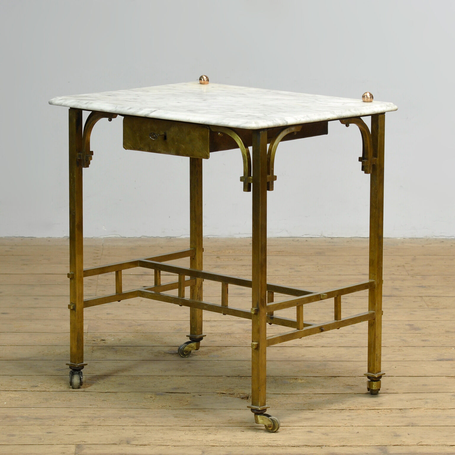 Small brass table with marble top, circa 1910