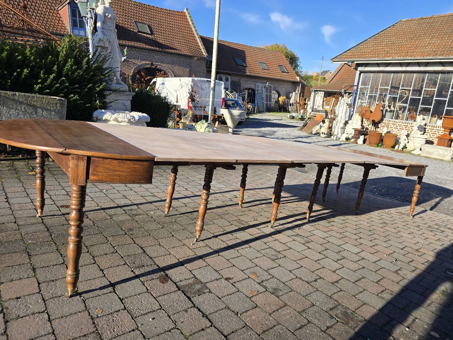 12-foot round oak table with 7 extensions / 20 people