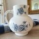 Antique water jug in ironstone, Sarreguemines, decorated with blue daisies.