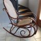 Rocking-chair in turned wood and cannage