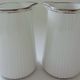 Pair of creamers in white porcelain enhanced with platinum