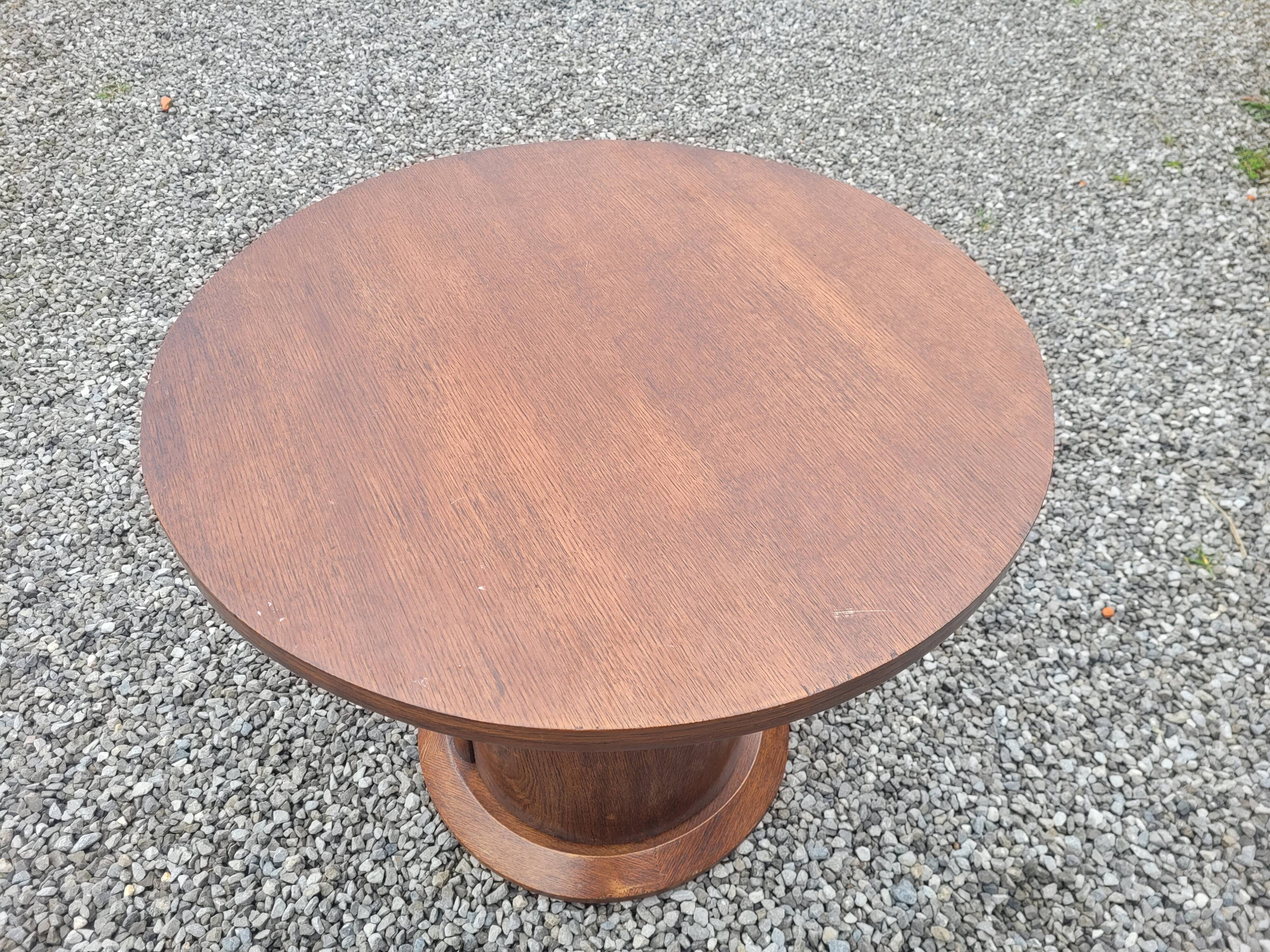 Vintage round oak coffee table with a door