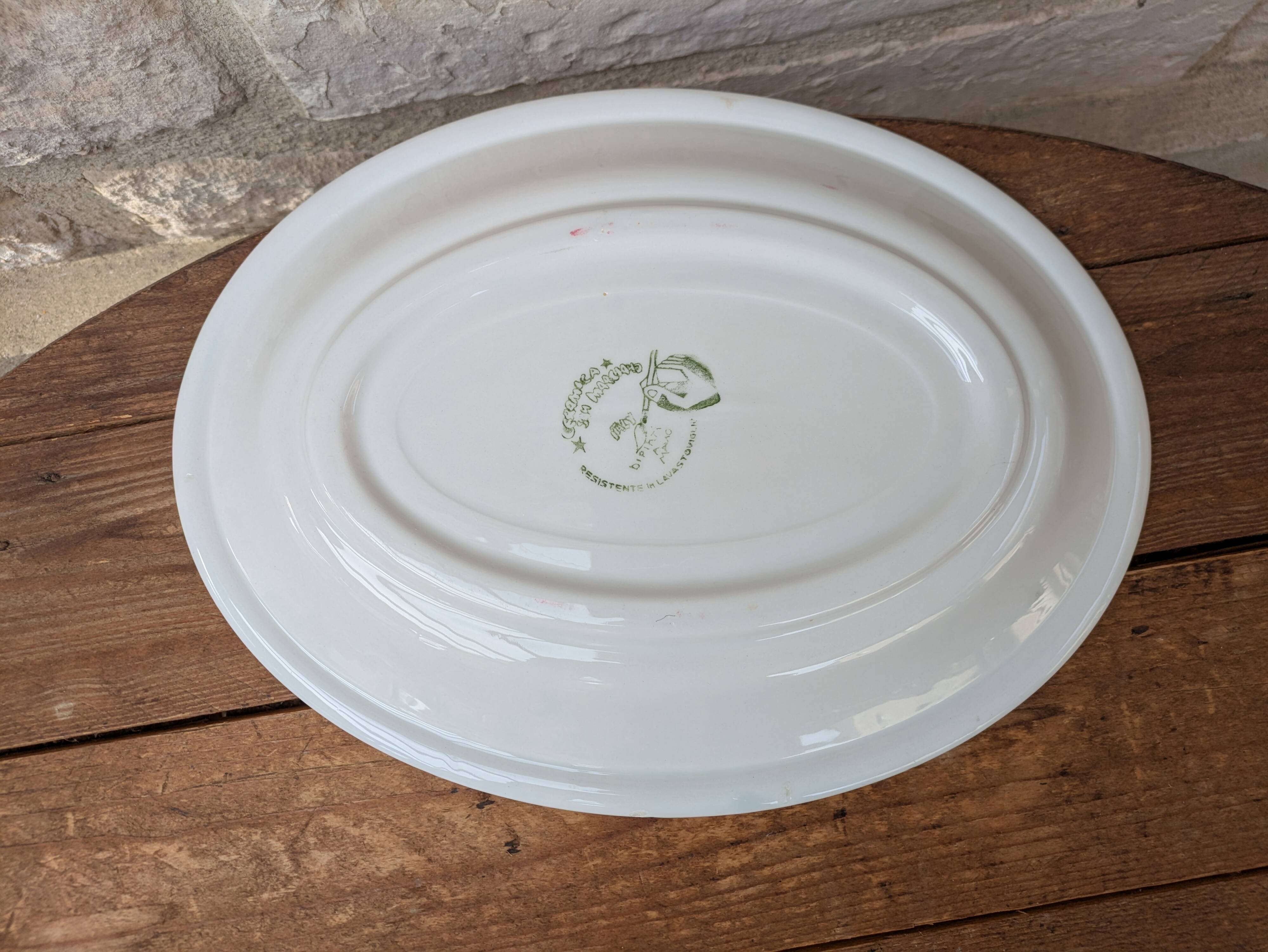 Oval serving dish with hand-painted pink flowers in San Marciano ceramic.