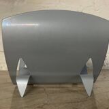 Designer log holder in enameled sheet metal