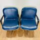 2 office chairs attr. to Strafor, white molded plastic shell, blue skai and chrome metal star base